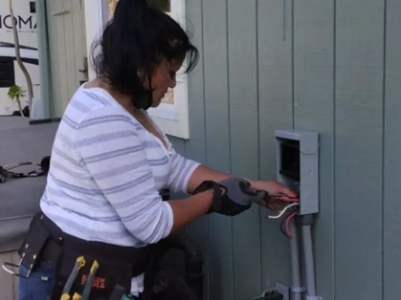 Licensed electrician wiring an exterior subpanel in Glendale